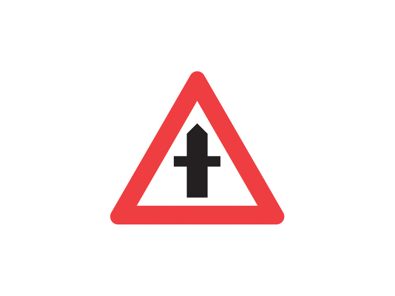 Færdselstavle A11 betyder "Farligt vejkryds" og advarer om et vejkryds, hvor den krydsende trafik har ubetinget vigepligt, men hvor denne vigepligt kan være svær at overholde på grund af f.eks. dårligt udsyn. Dette skilt bruges til at advare trafikanter om, at der er en potentiel fare for uheld, og at man bør være ekstra opmærksom på den krydsende trafik.